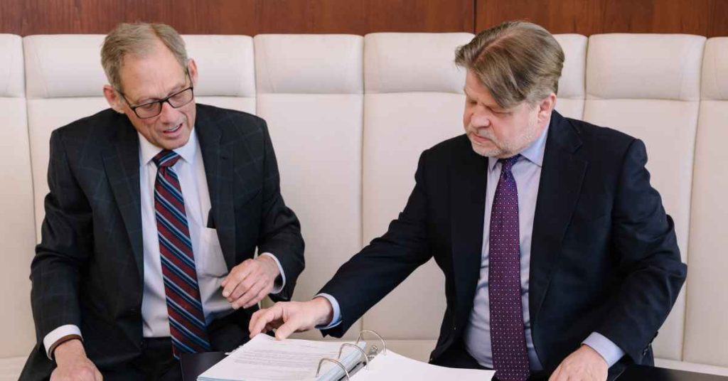 statistics being reviewed by two auto accident attorneys at their houston law office