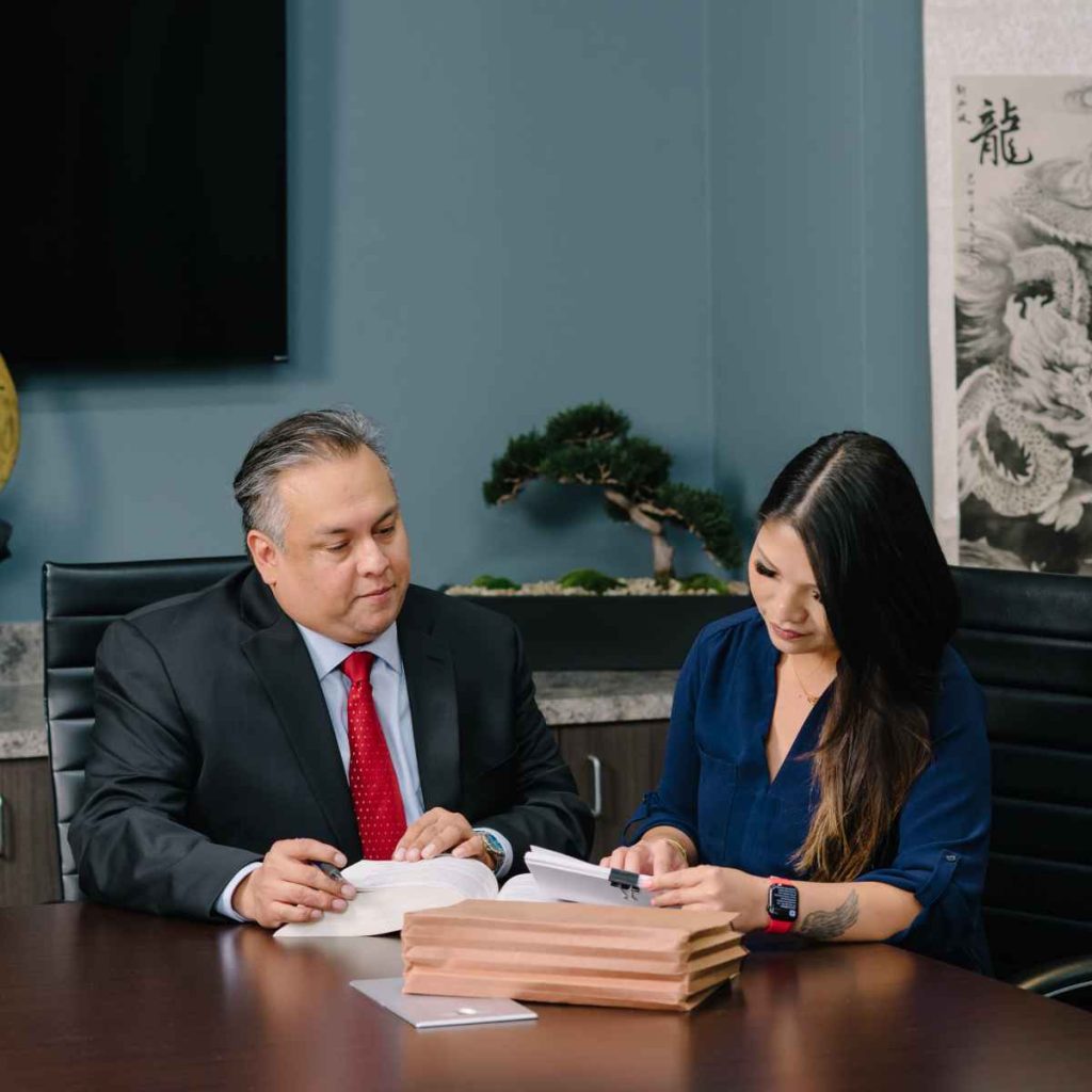 the legal team of a car accident lawyer in houston tx reviewing a claim