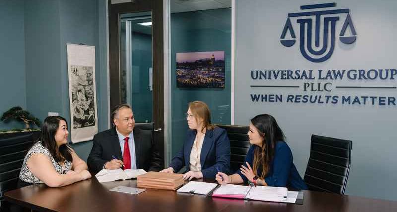 houston civil law attorney meeting with clients to discuss legal options