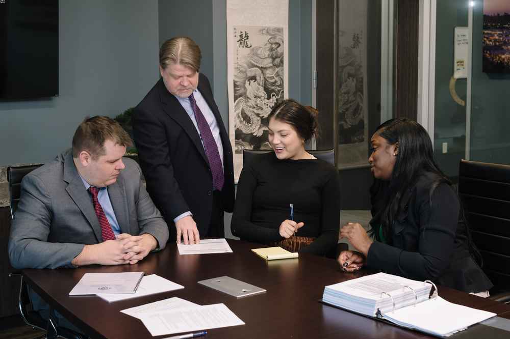 The DWI defense team gathers at their Houston-based law firm to build a strategy for their client