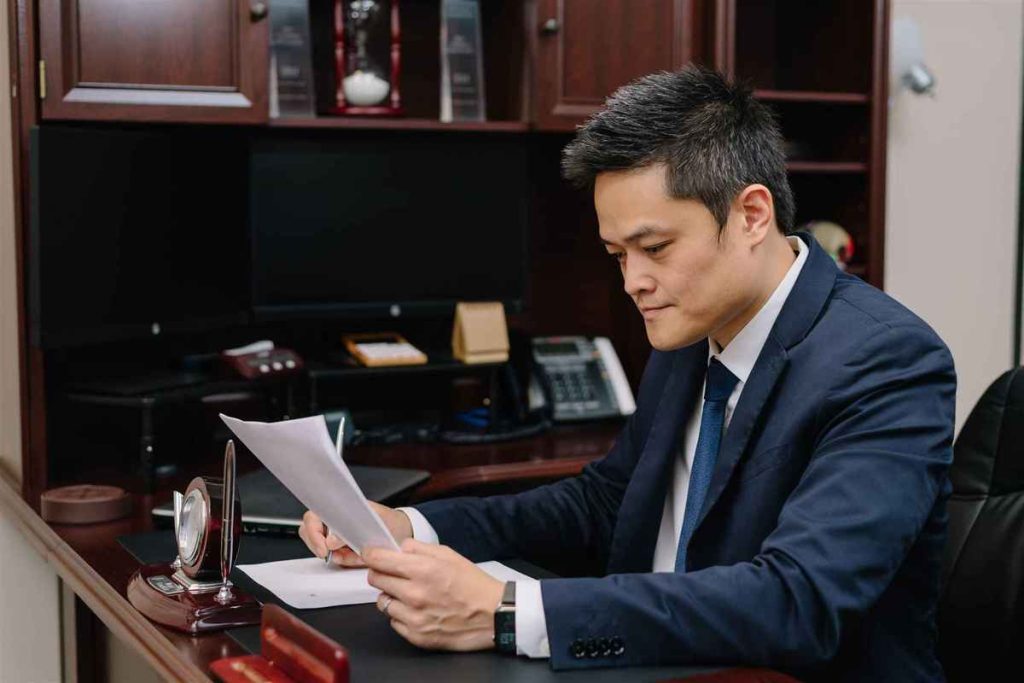 Houston Criminal Defense attorney Brian Nguyen reviewing evidence for a case in Houston, Texas