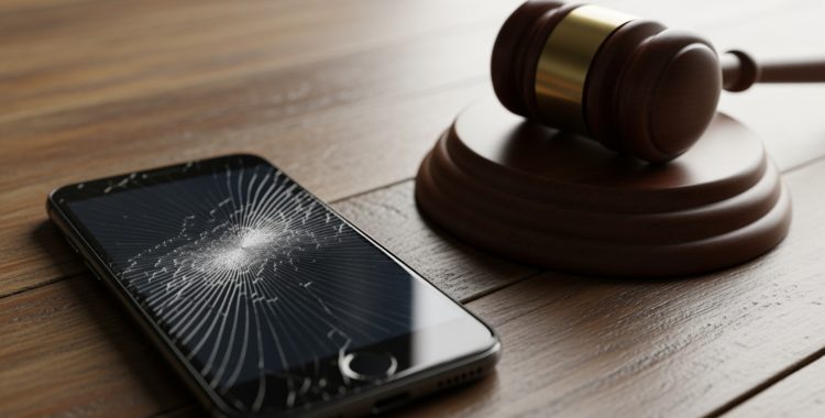 cracked phone screen next to a gavel - criminal mischief