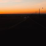 long, straight, and monotonous highway at dusk - highway hypnosis
