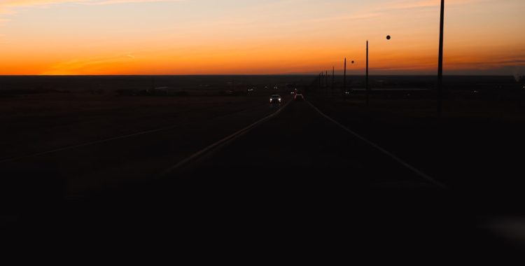 long, straight, and monotonous highway at dusk - highway hypnosis