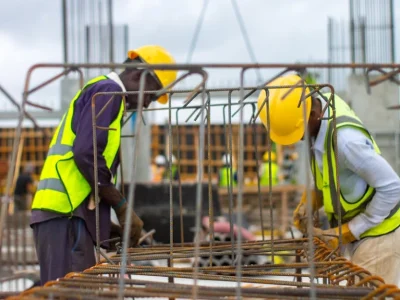 Construction worker wearing hard hat at job site - Falling object injury