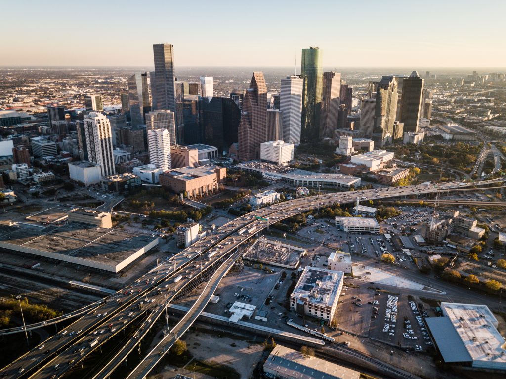 Aerial view of downtown Houston and the I-45 interchange at rush hour