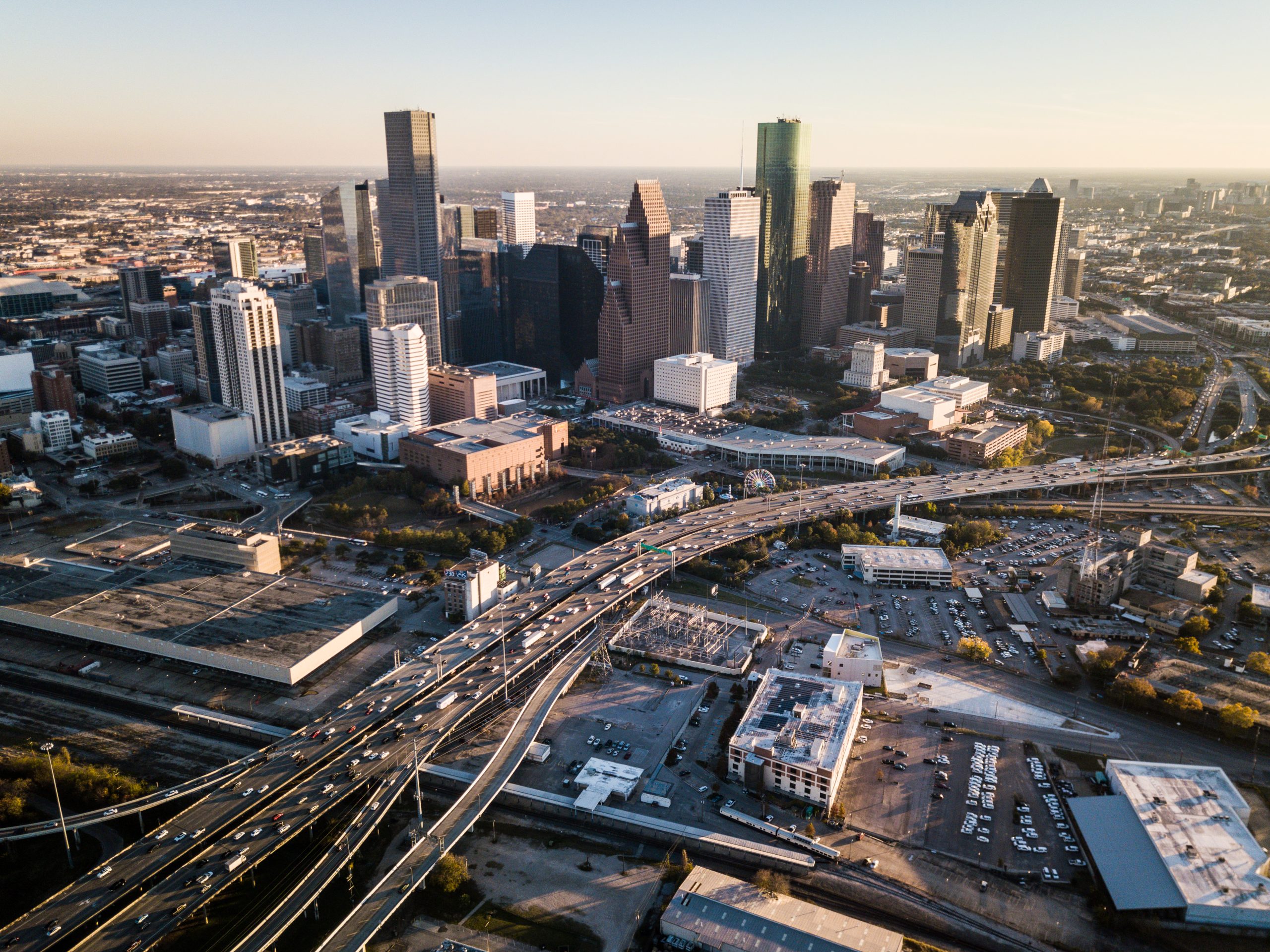Aerial view of downtown Houston and the I-45 interchange at rush hour