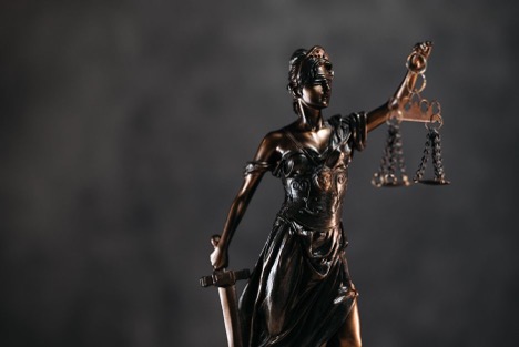 Lady Justice statue representing legal accountability in a Houston premises liability case.